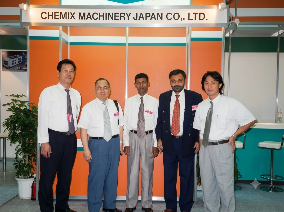 Five men in front of the CHEMIX MACHINERY JAPAN stand at the IPF exhibition in Japan, 1999